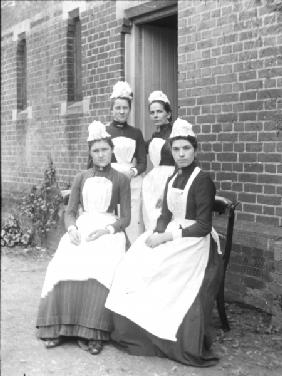 Four domestic maids (b/w photo) 