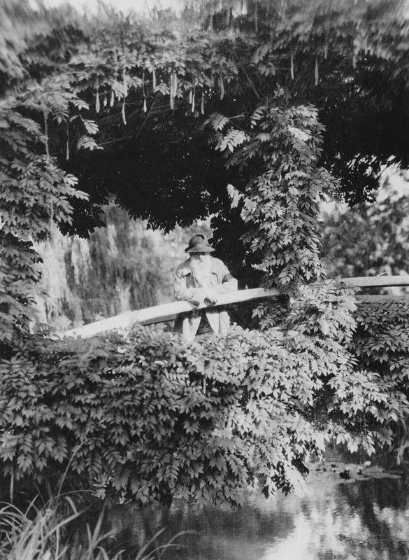 Claude Monet (1841-1926) on the Japanese Bridge in his garden at Giverny, c.1920 (b/w photo)  od French Photographer