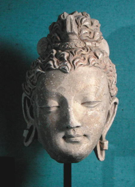Head of a Smiling Buddha, Greco-Buddhist style, from Hadda od Afghan School