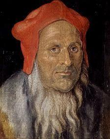Portrait of a bearded man with a red bonnet
