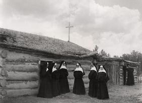 Nuns in front of the Saint Labre mission, Ashland, Montana (b/w photo)