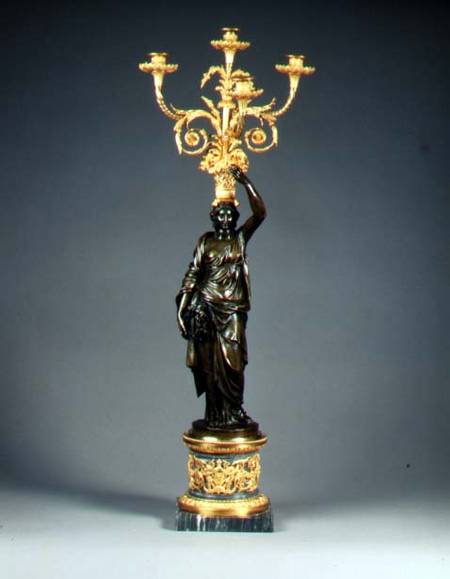Louis XVI four-light candelabraormolu branches rising from a basket balanced on the head of a patina od Anonymous