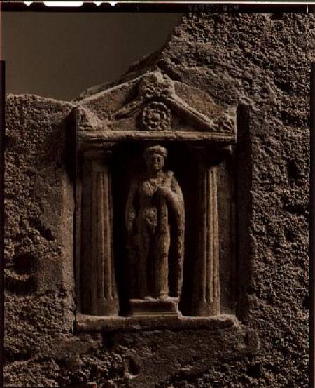 Marble and sandstone votive stele with female figure holding 'sign of Tanit' from Sulcis od Anonymous