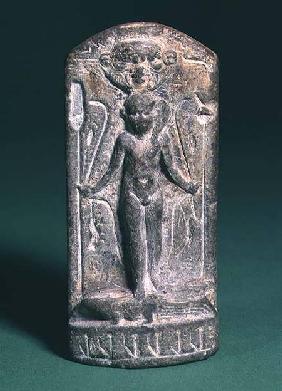 Cippus depicting a nude sun-god Horus on the front, holding sceptres and snakes in both hands and st