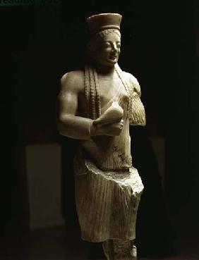Kore figure of a young female Athenian holding a bird offeringGreek