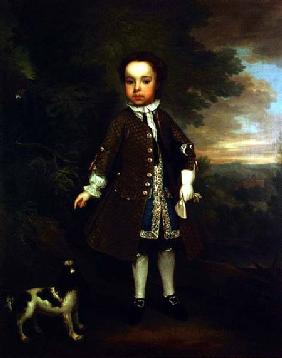 Portrait of a small boy with a spaniel and a parrot