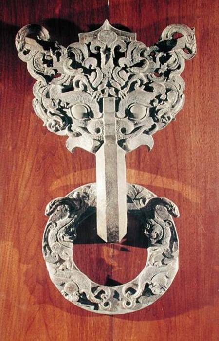 'P'u shou' door knocker with a taotie design surmounted by a phoenix and holding a ring with sculpte od Chinese School