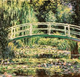 Bridge in Monets garden with white waterlilies
