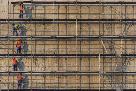 Construction workers and scaffolds