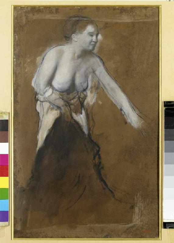 Young woman at her toilet od Edgar Degas