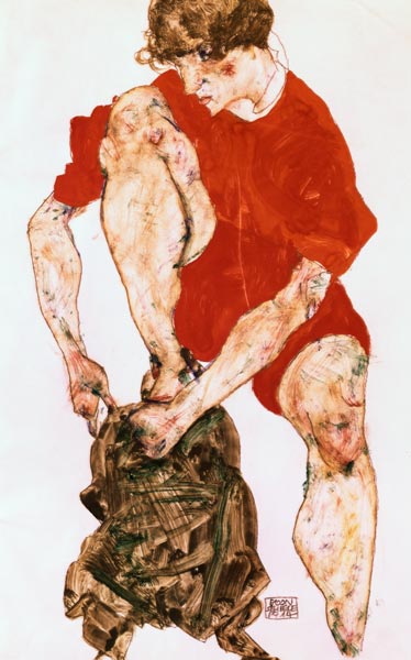 Female model in a fiery red jacket and trousers od Egon Schiele