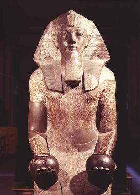 Statue of Queen Makare Hatshepsut (1503-1482 BC) holding two vases containing offerings of wine and