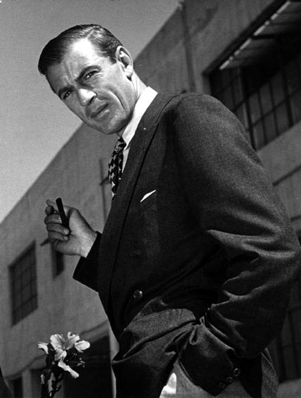 American Actor Gary Cooper smoking a pipe od English Photographer, (20th century)