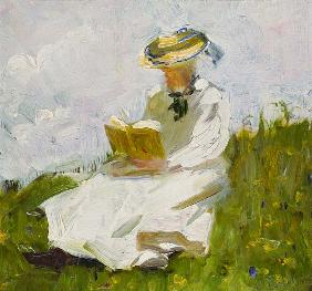 Reading woman in the greenery
