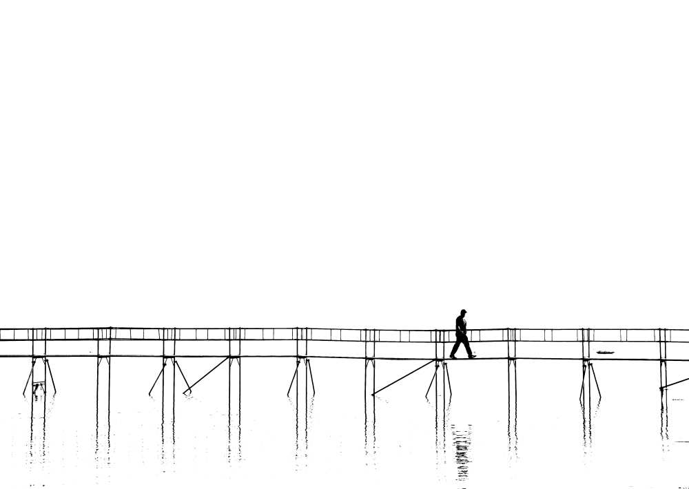 The lonely man on the plank bridge od Hans Peter Rank