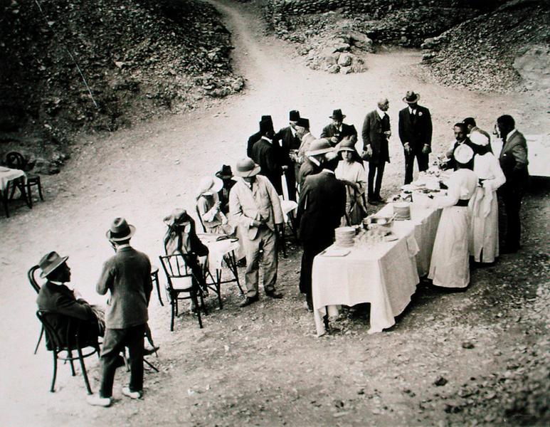 Distinguished visitors taking refreshments near the Tomb of Tutankhamun at the opening of the inner  od Harry Burton