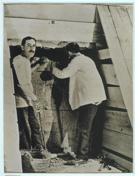 Howard Carter (1873-1939) and a colleague beside a partially demolished wall of one of the tombs, Va od Harry Burton