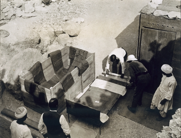 Moving the centre portion of one of the beds or couches from the Tomb of Tutankhamun, Valley of the  od Harry Burton