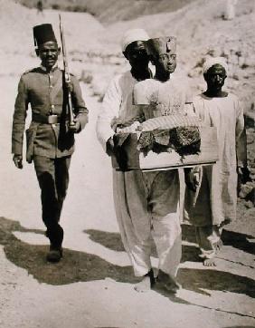The mannequin or bust of Tutankhamun being carried from the tomb, Valley of the Kings, 1922 (gelatin