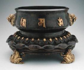 Censer and stand with buddhist characters in relief resting on four frog feet