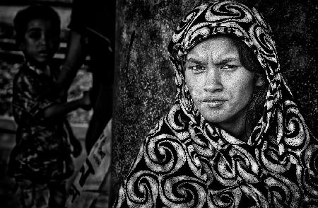 Woman waiting at a train platform - Dhaka