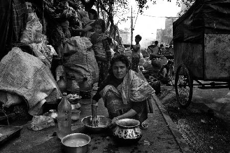 Cleaning rice in the streets of Bangladesh.