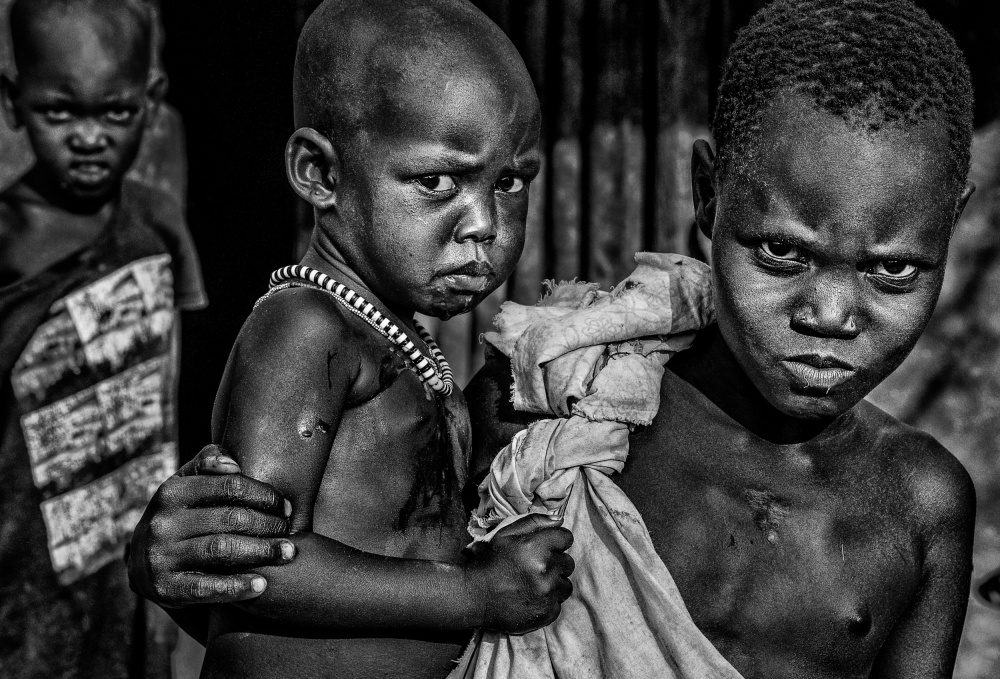 South Sudanian children showing angry expression. od Joxe Inazio Kuesta Garmendia