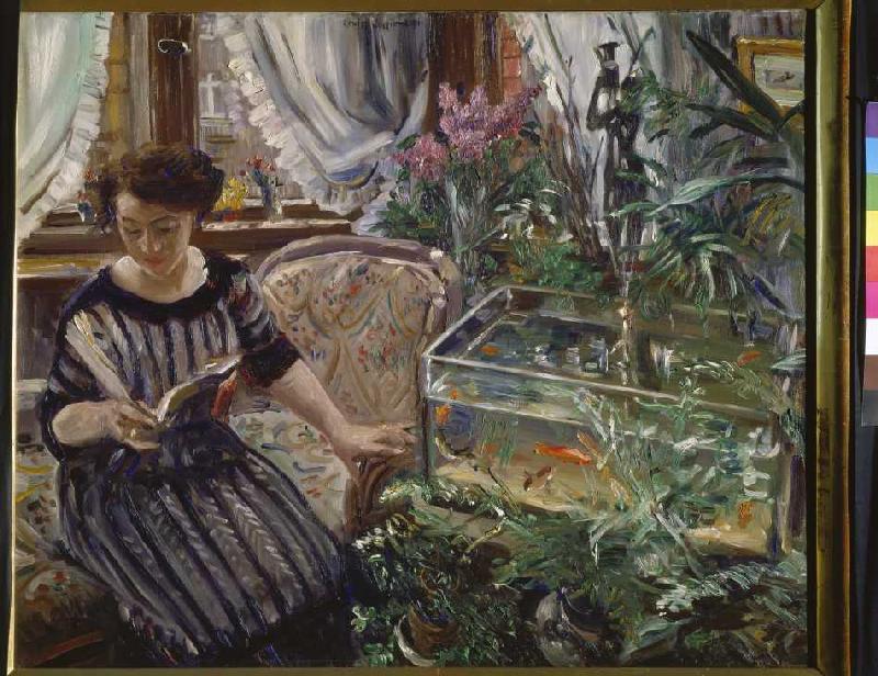 Reading woman at the goldfish pool od Lovis Corinth