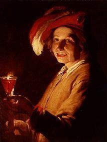 Young man with wine-glass and candle