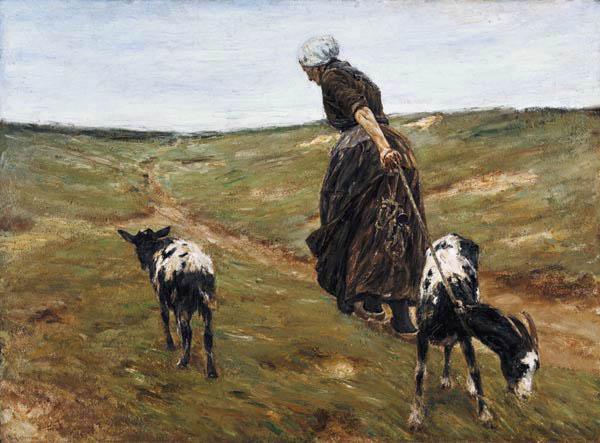 Woman with nanny-goats in the dunes
