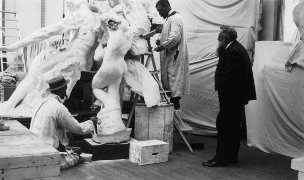 Auguste Rodin (1840-1917) in his Paris studio watching the construction of a sculpture, 1905 (b/w ph od 