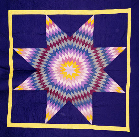 An Amish Pieced & Quilted Cotton Coverlet Worked In A Multicolored Lone Star On A Navy Background od 