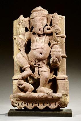 A Central Indian, Rajasthan, Red Sandstone Figure Of Ganesha Standing With His Right Leg On His Vehi