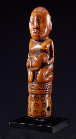 A Kongo Ivory Staff Finial Depicting A Kneeling Female Figure Holding A Child