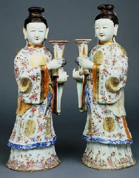 A Pair Of Famille Rose Candle Holders Modelled As Standing Ladies