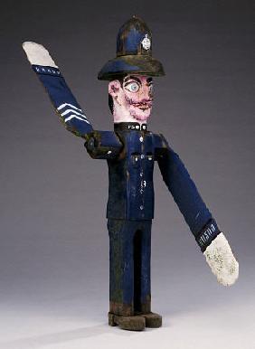 A Polychrome Wood And Metal Whirligig Modelled As A Police Sergeant, 20th Century