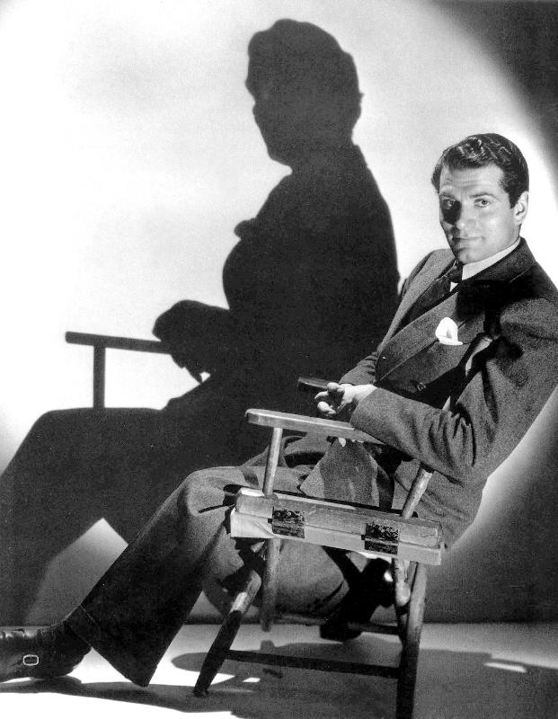 English Actor Laurence Olivier seated on a chair's director od 