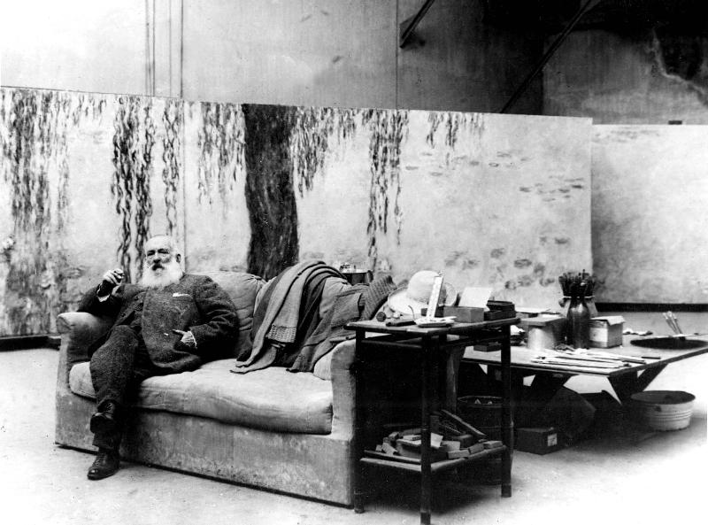 French painter Claude Monet in his workshop in front of one of his paintings Waterlilies od 