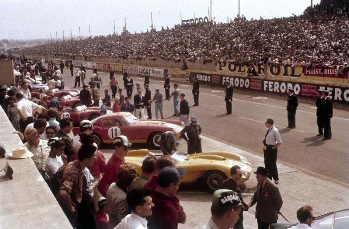 Le Mans racing circuit, France. The cars are lined up in the pits, with the spectator stands opposit od 