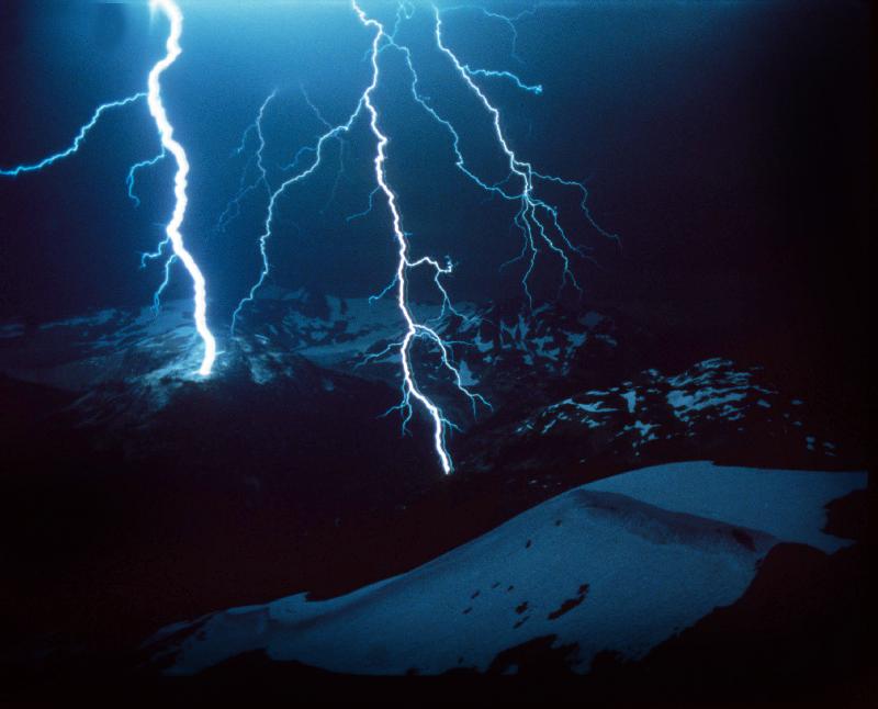 Lightning during a storm over snowy mountains od 