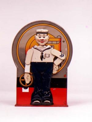 Tin Mechanical bank in form of a sailor. When the lever is depressed, he stands to attention and sal od 