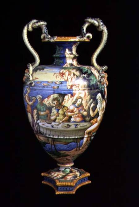 Maiolica urn with two handles in the shape of serpents, the body decorated with an al fresco banquet od Orazio Fontana of Urbino