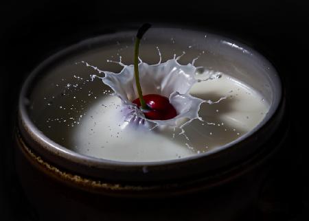 The cherry in a drop of milk