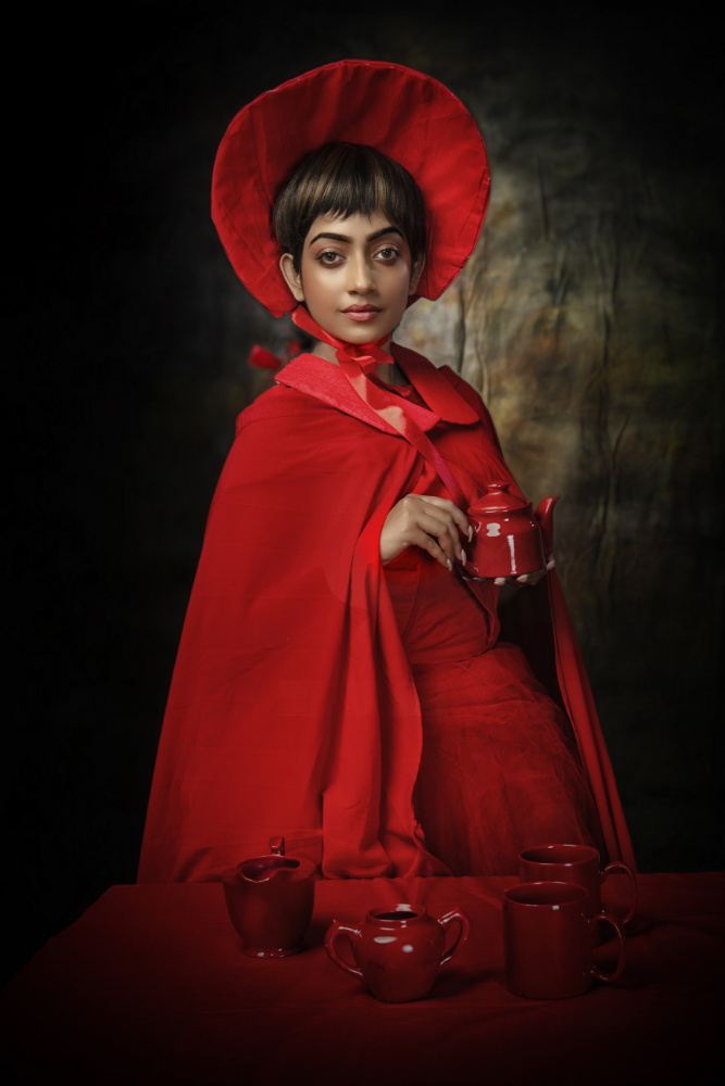 THE GIRL WITH RED TEA SET od PARTHA BHATTACHARYYA