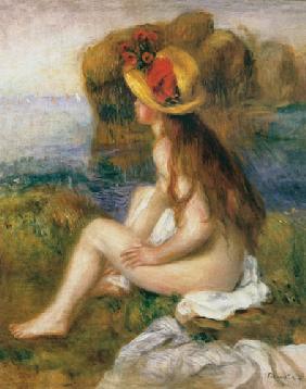 Seated female bather in a straw hat