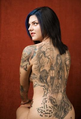 Woman with a tattoo on her back od Scott Griessel