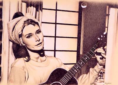 Audrey Hepburn hraje na kytaru