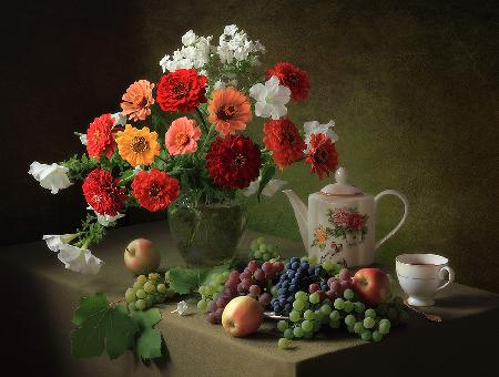 Still life with a bouquet of zinnias and fruit