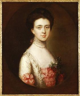 Portrait of a lady, bust length, in a pink and white dress trimmed with lace and a pearl necklace