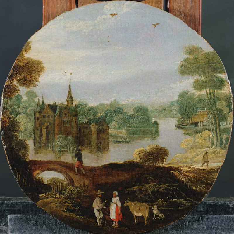 A wooded river landscape with a castle and travellers conversing od Tobias Verhaecht